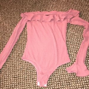 Pink off the shoulder ruffle bodysuit